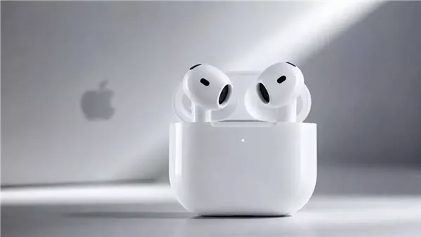 AirPods 5 in charging case with Apple logo backdrop